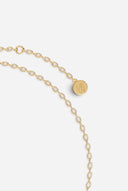 TAYLR gold chain bracelet featuring a delicate round logo charm with engraved detailing on a fine link chain