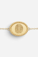 TAYLR gold oval rope bracelet featuring two engraved fingerprints side by side on a delicate chain
