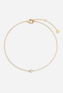 TAYLR solitaire lab diamond bezel bracelet in gold with a delicate chain and secure lobster clasp closure.