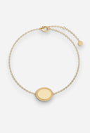 TAYLR gold oval rope bracelet with a polished engravable charm on a delicate chain, perfect for everyday wear.