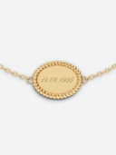 TAYLR gold oval rope bracelet with a polished engravable surface featuring a date engraving on a delicate chain.