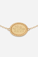 TAYLR gold oval bracelet featuring a rope-style border and a custom engraved family stick figure drawing.