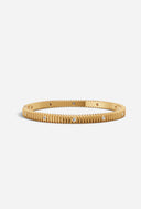 TAYLR 18k gold vermeil ribbed bangle featuring inlaid lab-grown diamonds in a sophisticated textured design.