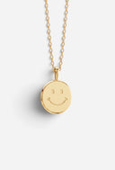 TAYLR gold coin necklace featuring a minimalist engraved smiley face symbol on a delicate chain