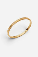 TAYLR 18k gold vermeil ribbed bangle featuring delicate lab-grown diamond accents in a sophisticated textured design.