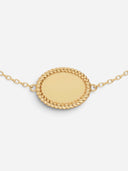 TAYLR Oval Rope Bracelet in polished gold with a smooth engravable center and delicate rope-textured frame.